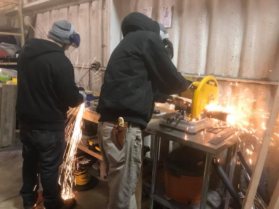 Custom Concessions fabricating food truck propane tank cages in the shop.